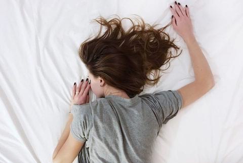 woman struggling with fatigue and waking up
